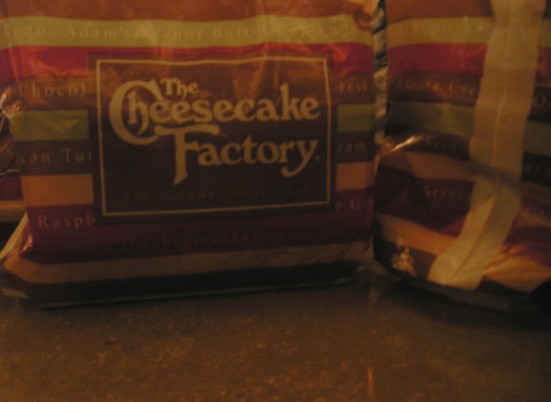 A bag from the Cheesecake Factory, filled with goodies!