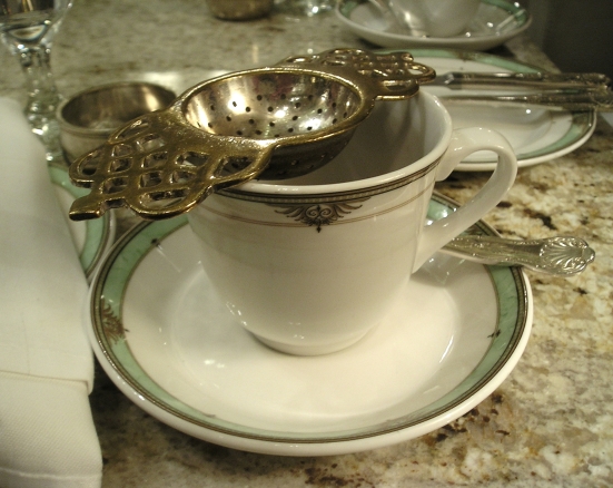 Teacup with tea strainer at the Drake Hotel afternoon tea